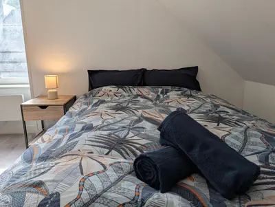 Un ou plusieurs lits dans un hébergement de l'établissement Chaleureux T3 Duplex Centre - 10 min de la gare à pied