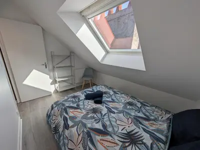 Un ou plusieurs lits dans un hébergement de l'établissement Chaleureux T3 Duplex Centre - 10 min de la gare à pied