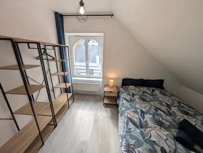 Un ou plusieurs lits dans un hébergement de l'établissement Chaleureux T3 Duplex Centre - 10 min de la gare à pied
