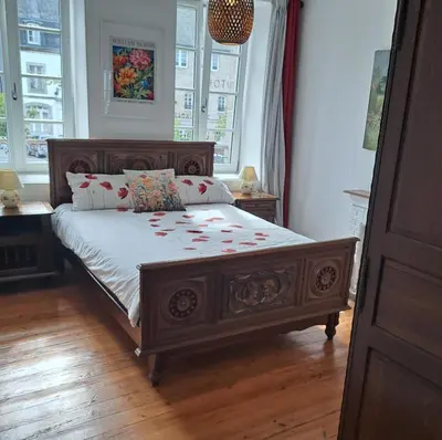 Un ou plusieurs lits dans un hébergement de l'établissement Bel appartement au centre