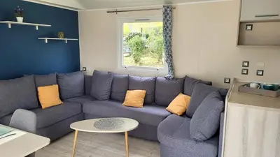 Coin salon dans l'établissement MH GRAND CONFORT 40 m2 3CH 2 SDB 2 TOILETTES