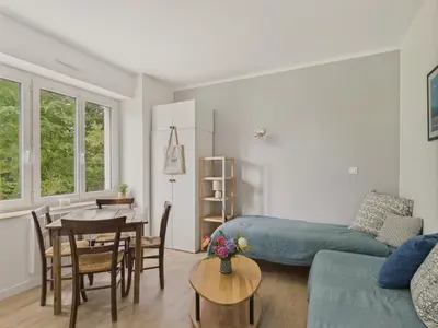 Coin salon dans l'établissement Dépendance 2 adultes 2 enfants - avec jardin