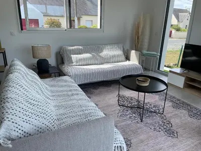 Coin salon dans l'établissement Jolie maison neuve proche du Guilvinec et des plages