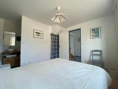 Un ou plusieurs lits dans un hébergement de l'établissement Maison avec terrasse vue sur mer
