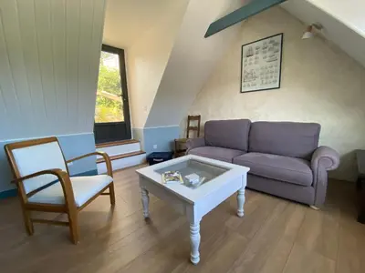 Coin salon dans l'établissement Maison avec terrasse vue sur mer