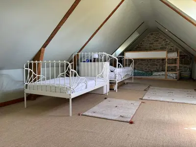 Un ou plusieurs lits dans un hébergement de l'établissement MEZKOLE - Maison de vacances familiale à Plouguerneau 10 personnes, jardin, proche plages