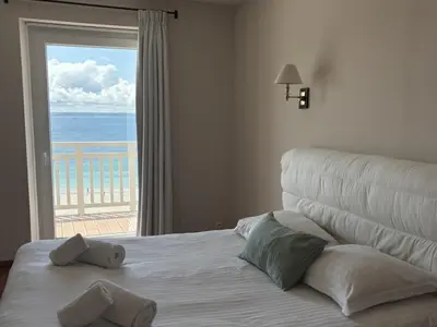 Un ou plusieurs lits dans un hébergement de l'établissement Le Balcon de Tresmeur