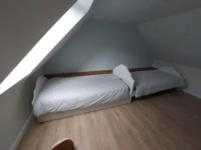 Un ou plusieurs lits dans un hébergement de l'établissement Petite maison à la campagne
