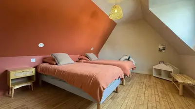 Un ou plusieurs lits dans un hébergement de l'établissement Ty Glaz - Maison Bord de mer avec jardin, proche plage
