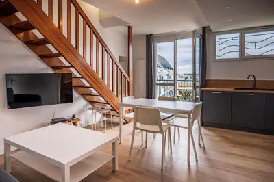 Télévision ou salle de divertissement dans l'établissement Les balcons de la Thalasso