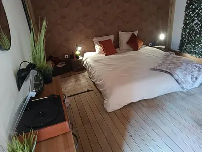 Un ou plusieurs lits dans un hébergement de l'établissement Cabane cozzi dépendance à la ferme avec jacuzzi