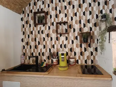 Cuisine ou kitchenette dans l'établissement Cabane cozzi dépendance à la ferme avec jacuzzi