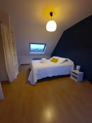Un ou plusieurs lits dans un hébergement de l'établissement Maison calme à 10 min des plages