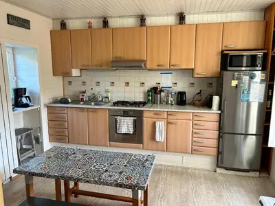 Cuisine ou kitchenette dans l'établissement En bord de plage à la Pointe du Raz