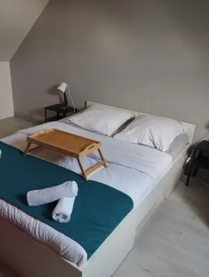 Un ou plusieurs lits dans un hébergement de l'établissement Quartier Saint Jacques - Maison 5 chambres