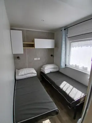 Un ou plusieurs lits dans un hébergement de l'établissement Mobil home Bora Bora
