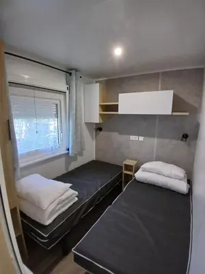 Un ou plusieurs lits dans un hébergement de l'établissement Mobil home Bora Bora