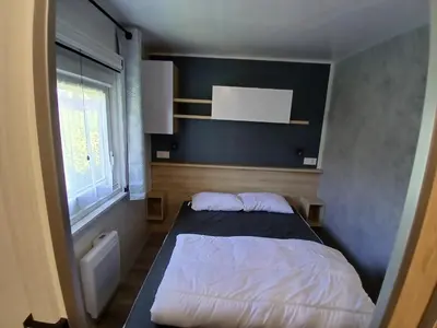 Un ou plusieurs lits dans un hébergement de l'établissement Mobil home Bora Bora