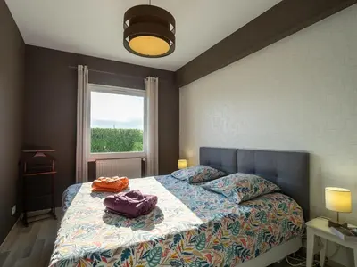 Un ou plusieurs lits dans un hébergement de l'établissement Holiday Home Chez David by Interhome