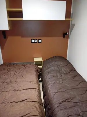 Un ou plusieurs lits dans un hébergement de l'établissement Mobilhome 42m2