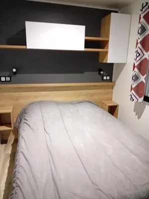Un ou plusieurs lits dans un hébergement de l'établissement Mobilhome 42m2