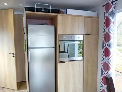 Cuisine ou kitchenette dans l'établissement Mobilhome 42m2