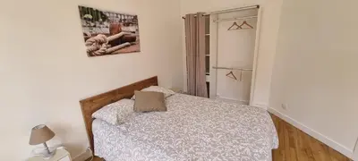 Un ou plusieurs lits dans un hébergement de l'établissement Logement spacieux et lumineux à Morlaix