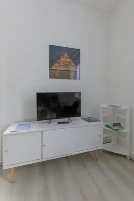 Télévision ou salle de divertissement dans l'établissement appartement entre plages et centre historique