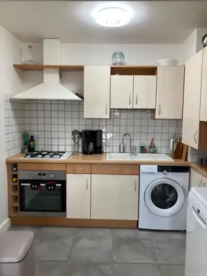 Cuisine ou kitchenette dans l'établissement Résidence le 46