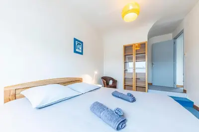 Un ou plusieurs lits dans un hébergement de l'établissement Family vacation home 100 m from beach - Ty For Tous