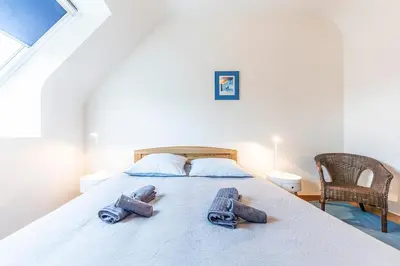 Un ou plusieurs lits dans un hébergement de l'établissement Family vacation home 100 m from beach - Ty For Tous