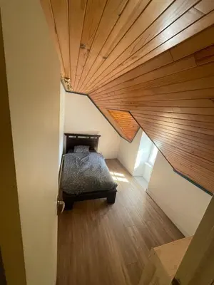 Un ou plusieurs lits dans un hébergement de l'établissement Charmante maison de campagne