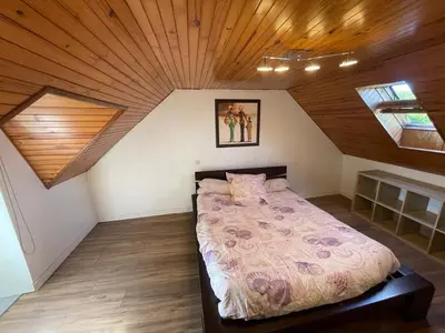 Un ou plusieurs lits dans un hébergement de l'établissement Charmante maison de campagne