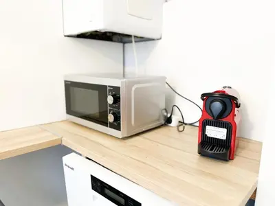 Cuisine ou kitchenette dans l'établissement Appartement lumineux avec balcon Parking privé