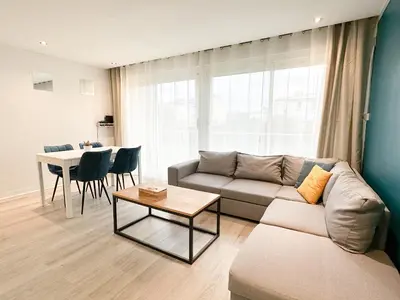 Coin salon dans l'établissement Appartement lumineux avec balcon Parking privé