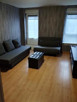 Coin salon dans l'établissement Appartement quartier St Michel