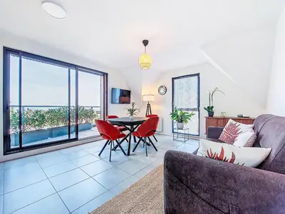 Coin salon dans l'établissement Apartment Maner roz by Interhome