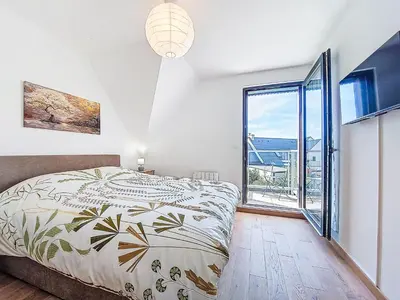 Un ou plusieurs lits dans un hébergement de l'établissement Apartment Maner roz by Interhome