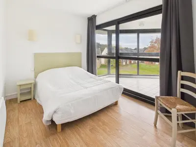 Un ou plusieurs lits dans un hébergement de l'établissement Face au Golf - Appart pour 6 avec balcon