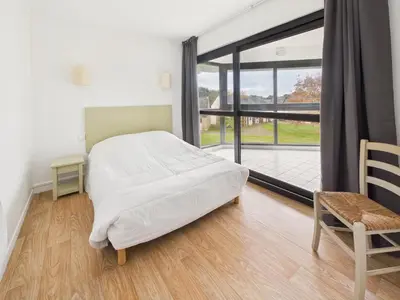 Un ou plusieurs lits dans un hébergement de l'établissement Face au Golf - Appart pour 6 avec balcon