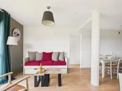 Coin salon dans l'établissement Face au Golf - Appart pour 6 avec balcon