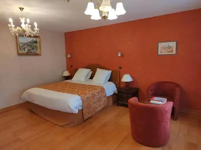 Un ou plusieurs lits dans un hébergement de l'établissement Hôtel Restaurant Le Bretagne