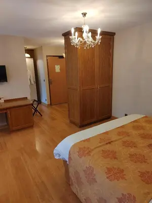 Un ou plusieurs lits dans un hébergement de l'établissement Hôtel Restaurant Le Bretagne