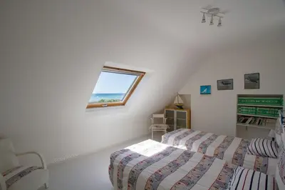 Un ou plusieurs lits dans un hébergement de l'établissement Tipoz'Immo - maison Les Coquillages - vue mer - animaux bienvenus - fibre inclus - linge inclus et lits faits - terrasse et jardin - parking gratuit - proche des commerces et des attractions touristiques
