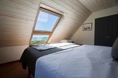 Un ou plusieurs lits dans un hébergement de l'établissement Tipoz'Immo - maison Les Coquillages - vue mer - animaux bienvenus - fibre inclus - linge inclus et lits faits - terrasse et jardin - parking gratuit - proche des commerces et des attractions touristiques