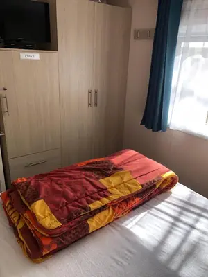 Un ou plusieurs lits dans un hébergement de l'établissement Mobilhome spacieux et calme