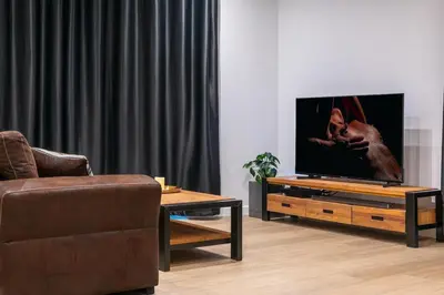 Télévision ou salle de divertissement dans l'établissement La Parenthèse Sensuelle - love room