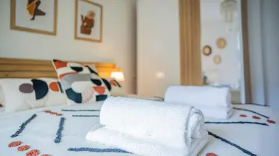 Un ou plusieurs lits dans un hébergement de l'établissement ECHAPPE ZEN Cozy secure apartment Sea and city Concarneau