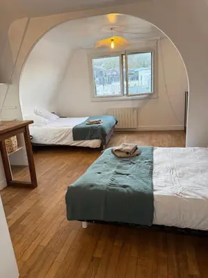 Un ou plusieurs lits dans un hébergement de l'établissement Duplex de charme Quimpérois Place Saint-Corentin