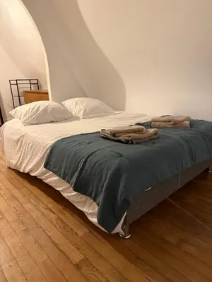Un ou plusieurs lits dans un hébergement de l'établissement Duplex de charme Quimpérois Place Saint-Corentin